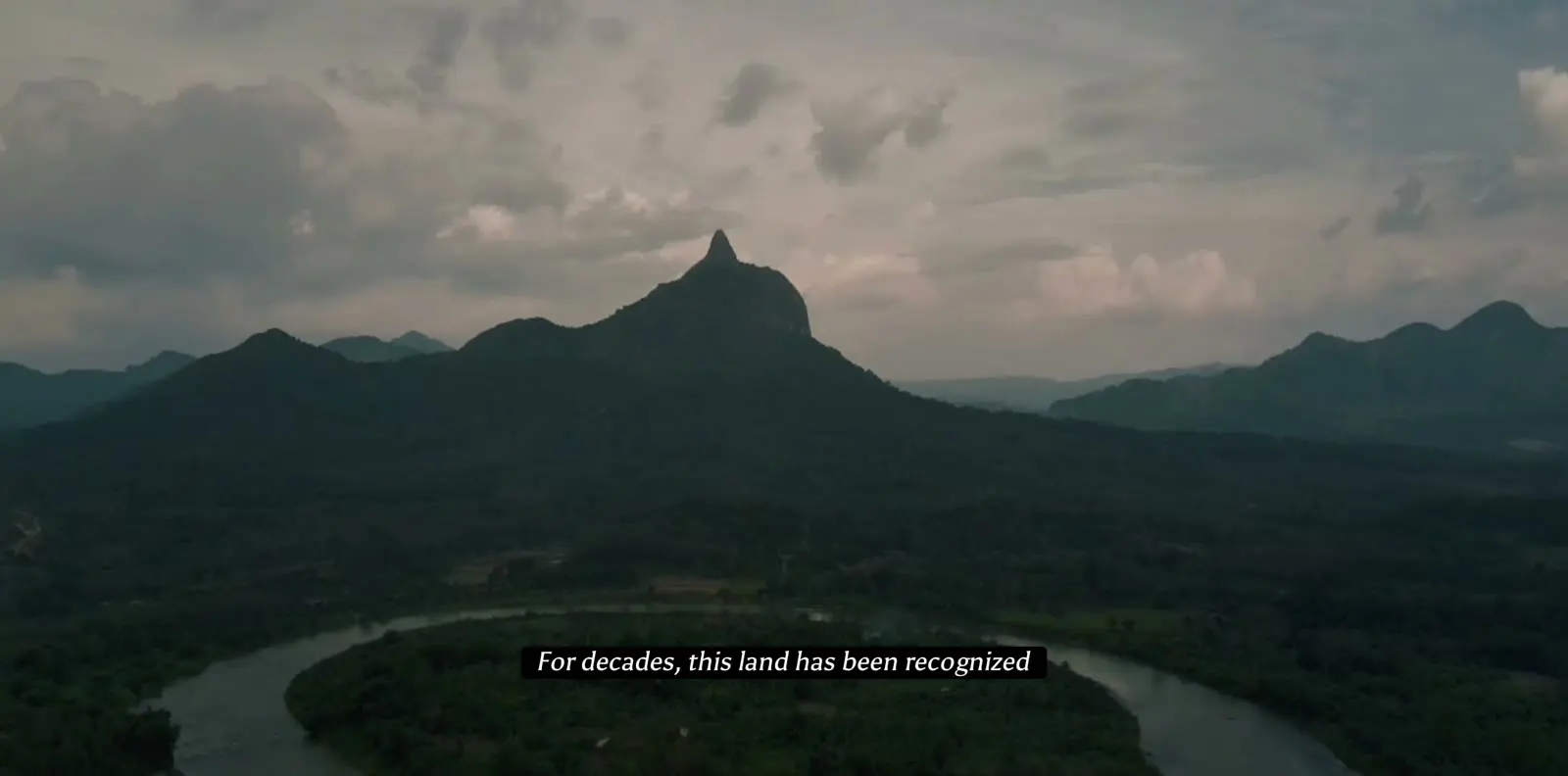Aerial view of a river bend and forested hills in East Kalimantan, from From the Ground Up